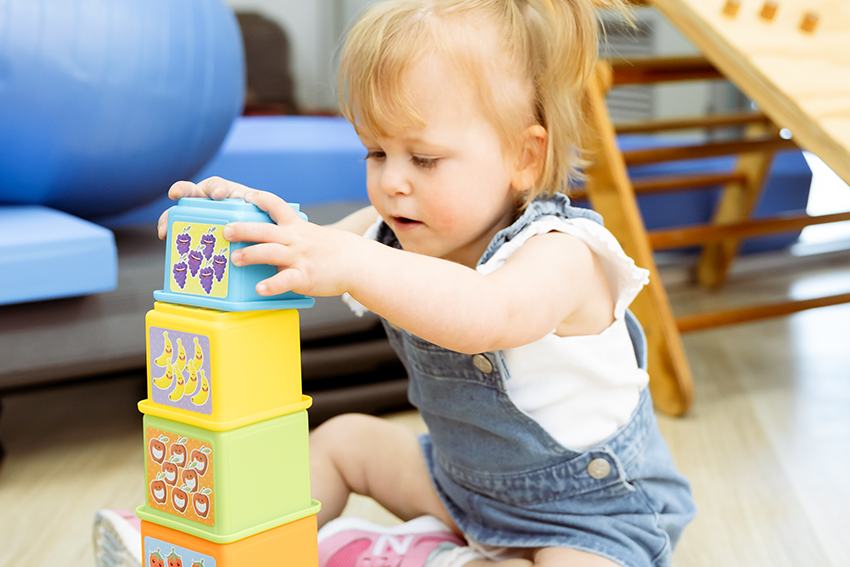 child playing with building blocks